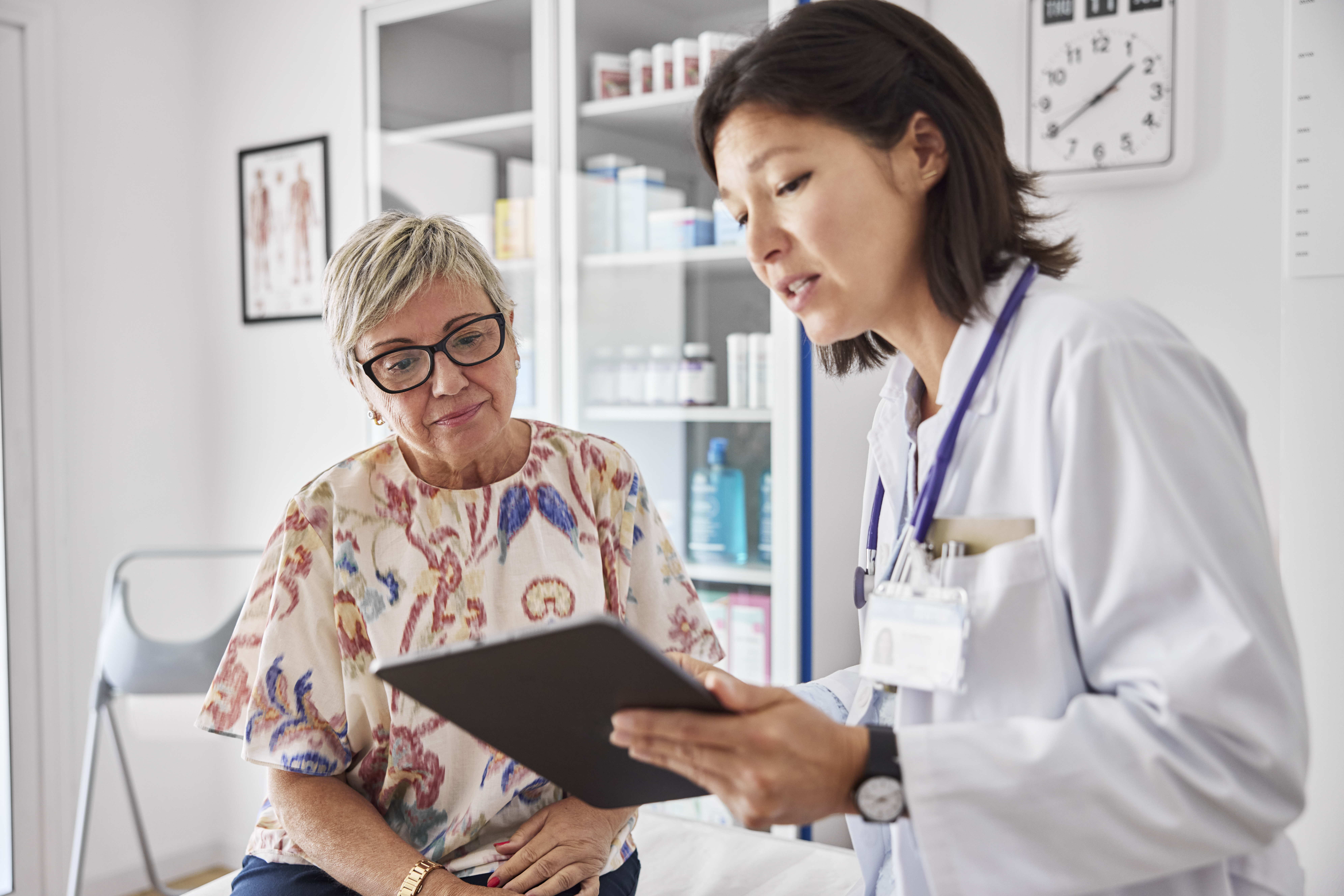 A doctor and a patient discussing a clinical trial for C. diff prevention